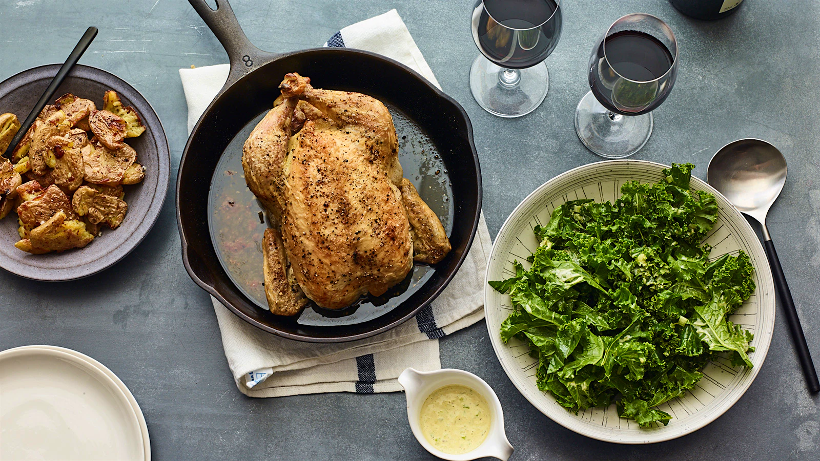Roast Chicken with Crispy Potatoes, Kale and Grilled-Scallion Vinaigrette.